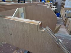 Looking aft from station C4. The longerons thread through the bulkhead notches, temporarily clamped in position during fitting.