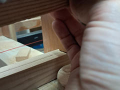 A technique that worked for me is to bend the longerons by hand and use them to trace the shape on the bulkheads.