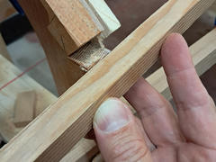 Then I used a straight scrap piece as a guide while cutting the marked line with the pull saw.