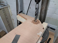 Drilling the first 22 mm wing pin hole through the C2/C3 assembly.